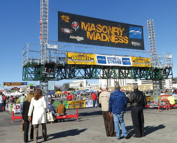 Spectators walk into the Masonry Madness area of the Gold Lot to watch the day’s competitions.