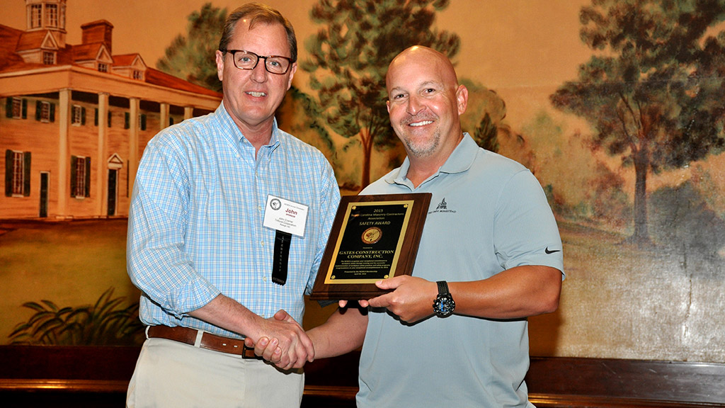 Mike Cook, safety manager of Gates Construction Co. (right), received the Safety Award plaque from TriSure’s John Cramer. NCMCA Insurance Program Partner TriSure Corporation is the sponsor of the award.