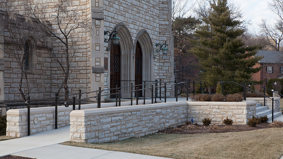 Limestone veneer around the new ADA compliant ramp and church entrance tie the new additions with the original structure. Built in 1930, the steps were removed, reconditioned and then replaced on the front of the new entry terrace.