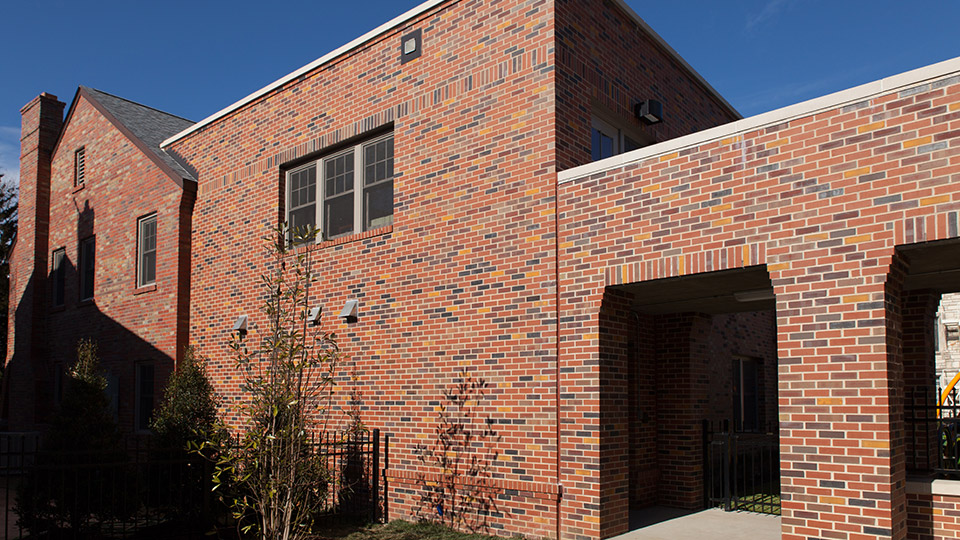 The bricklayers from Arnold Masonry successfully blended the brickwork of the new student center with the original houses.