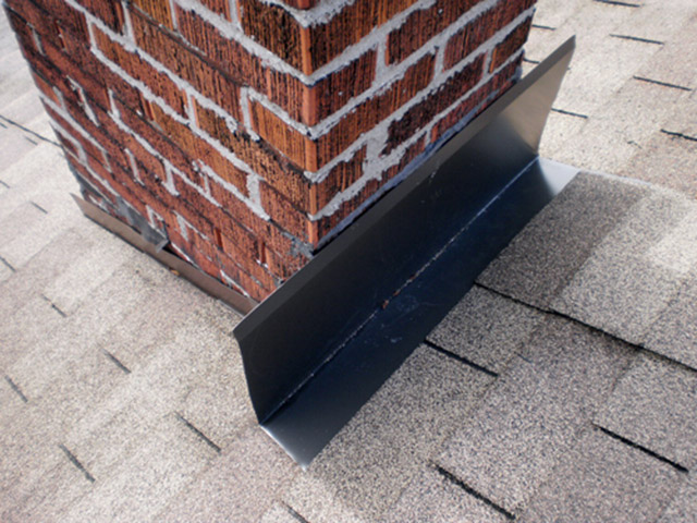 The head flashing here is not caulked or embedded into the mortar.