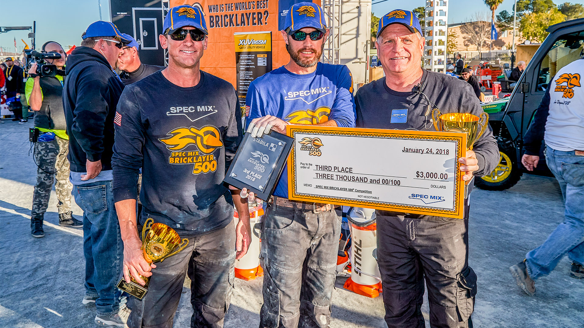 2017 World Champion, Matt Cash (middle), took third place with 658 brick laid. His mason tender Chet Huntley (left) was also returning to defend his Toughest Tender&reg; title from 2017.