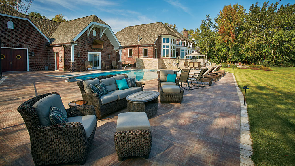 A 4,000–square-foot patio and pool area serve to unify the area around the home.